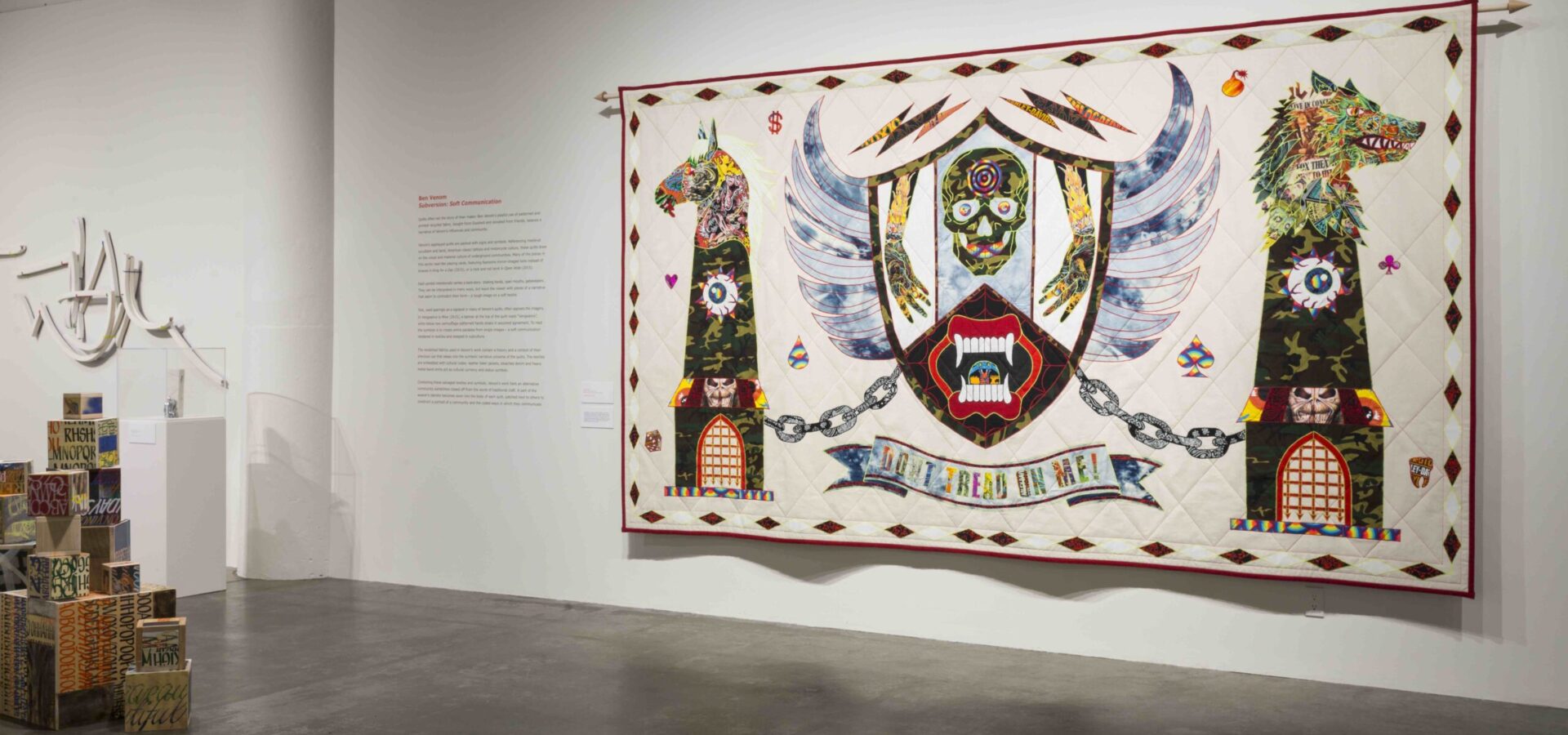 Large quilt hanging from wall